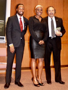Dorene Bell, new GSU Honor College Inductee, on stage w/Stephen Favors and honors college student president Prentiss Smiley
