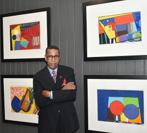 Simmons with work from his "I'm Back" series in the Dunbar Art Gallery. Credit: GLENN LEWIS/GSU Media Bureau